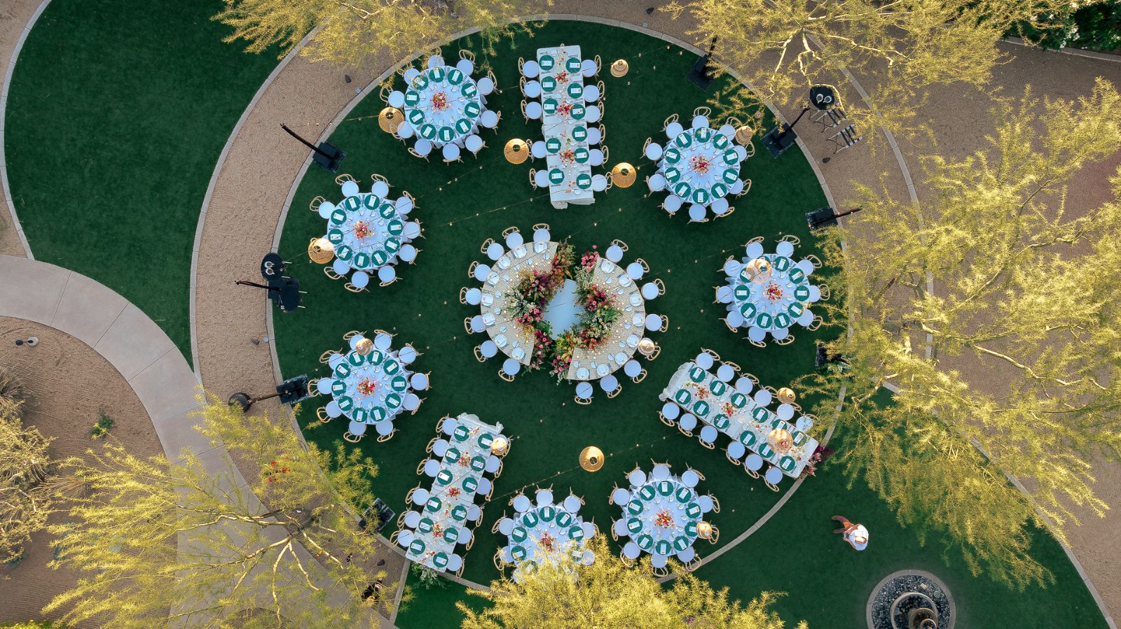 Overhead drone view of a wedding reception set on Albers Lawn at Andaz Scottsdale at dusk